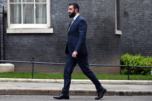 Syria's President Ahmed al-Sharaa arrives ahead of a meeting with Britain's Prime Minister Keir Starmer at 10 Downing Street in central London on March 31, 2026. (Photo by JUSTIN TALLIS / POOL / AFP)