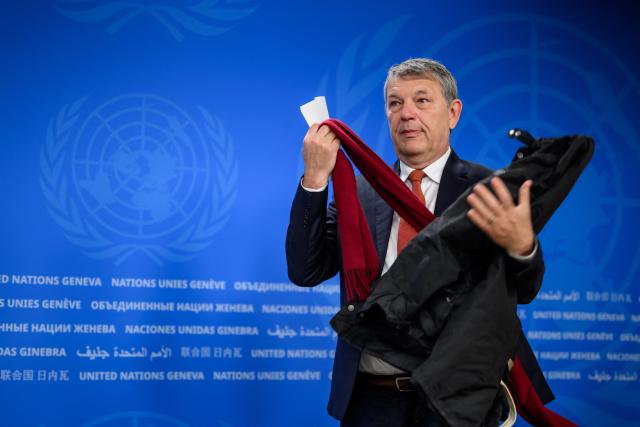 Outgoing UNRWA (United Nations Relief and Works Agency for Palestine Refugees in the Near East) Commissioner-General Philippe Lazzarini gathers his jacket and scarf after his final press after his final press conference at the United Nations offices in Geneva, on March 31, 2026. (Photo by Fabrice COFFRINI / AFP)