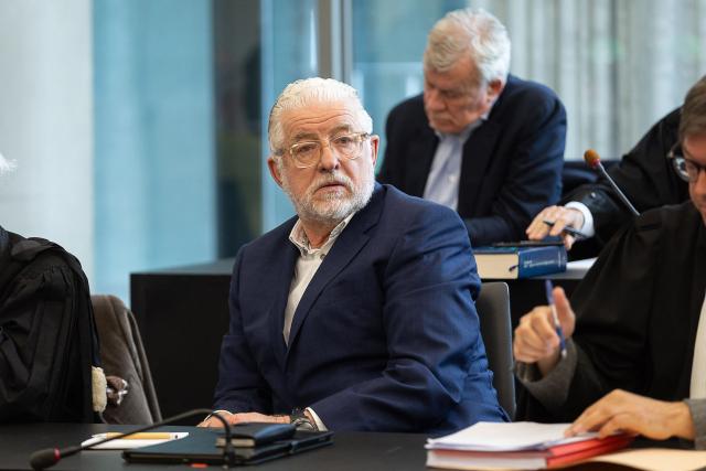 Former Optima Bank CEO Jeroen Piqueur attends the verdict in the Optima Bank case, in which he faces charges of money laundering, misappropriation of corporate assets and violations of banking legislation, at Ghent's criminal court in Ghent on March 31, 2026. (Photo by JAMES ARTHUR GEKIERE / Belga / AFP) / Belgium OUT