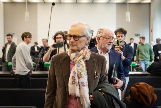 Former Optima Bank CEO Jeroen Piqueur (R) and lawyer Hans Rieder attend the verdict in the Optima Bank case, in which Piqueur faces charges of money laundering, misappropriation of corporate assets and violations of banking legislation, at Ghent's criminal court in Ghent on March 31, 2026. (Photo by JAMES ARTHUR GEKIERE / Belga / AFP) / Belgium OUT