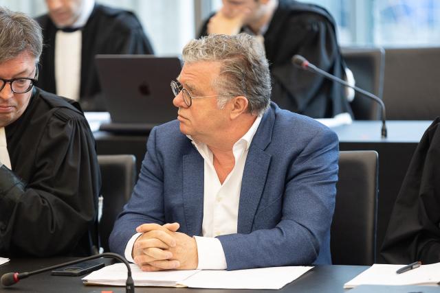 Defenddant former Optima Bank management Frank Vincent  attends the verdict in the Optima Bank case, in which the former CEO faces charges of money laundering, misappropriation of corporate assets and violations of banking legislation, at Ghent's criminal court in Ghent on March 31, 2026. (Photo by JAMES ARTHUR GEKIERE / Belga / AFP) / Belgium OUT