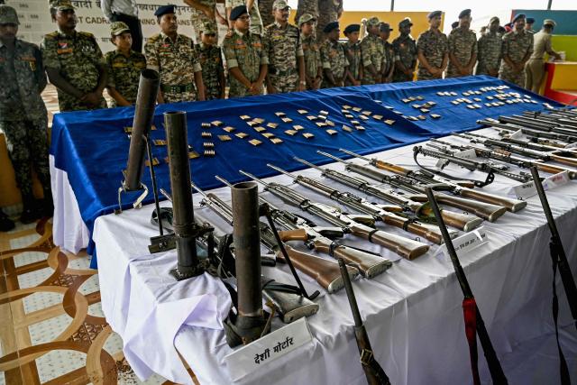 Weapons seized from Maoist rebels and fighters upon their surrender are displayed at a police facility in Dantewada in Chhattisgarh state's Bastar division on March 31, 2026. Indian police on March 31 displayed large caches of arms and ammunition seized from Maoist rebels, a day after officials declared the six-decade-long insurgency was over following a sustained security crackdown. (Photo by Shammi MEHRA / AFP)