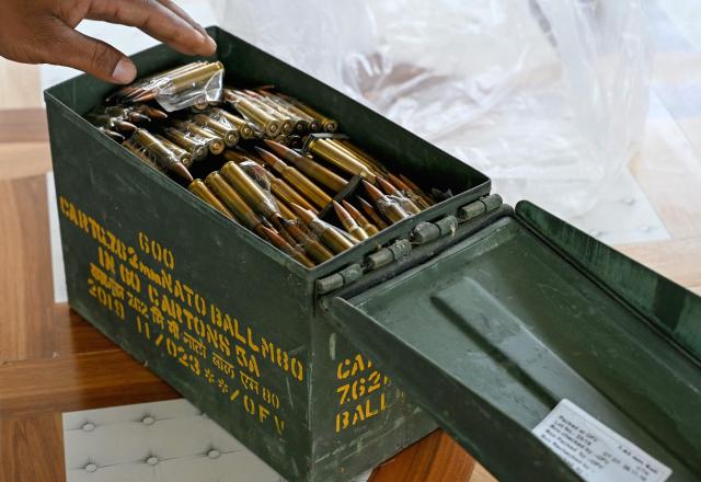 A security personnel shows bullets seized from Maoist rebels and fighters upon their surrender at a police facility in Dantewada in Chhattisgarh state's Bastar division on March 31, 2026. Indian police on March 31 displayed large caches of arms and ammunition seized from Maoist rebels, a day after officials declared the six-decade-long insurgency was over following a sustained security crackdown. (Photo by Shammi MEHRA / AFP)