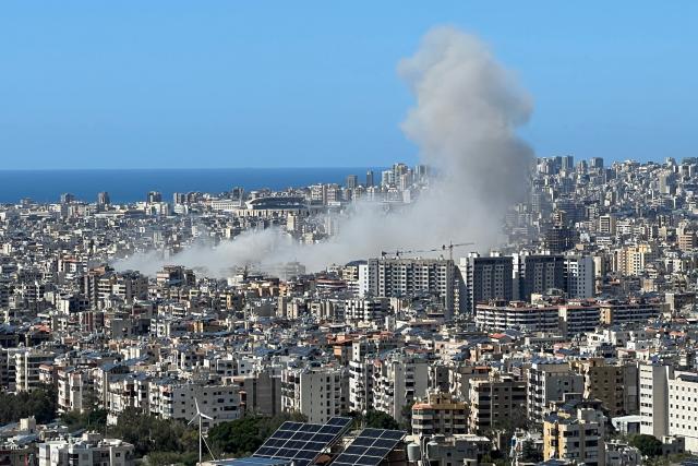 Smoke rises from the site of an Israeli airstrike that targeted an area in Beirut's southern suburbs on March 31, 2026. Israel's military reported on March 31 that four more of its soldiers had been killed in combat in southern Lebanon, where the war has spread and where they are battling Iranian-backed Hezbollah. (Photo by Kamal MEHANNA / AFP)