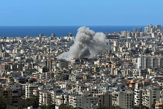 Smoke rises from the site of an Israeli airstrike that targeted an area in Beirut's southern suburbs on March 31, 2026. Israel's military reported on March 31 that four more of its soldiers had been killed in combat in southern Lebanon, where the war has spread and where they are battling Iranian-backed Hezbollah. (Photo by Kamal MEHANNA / AFP)
