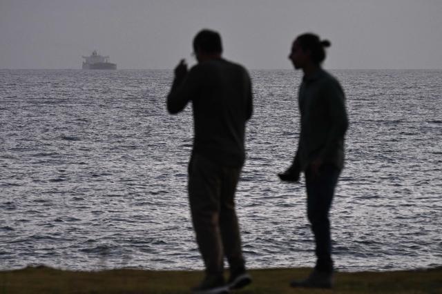The Russian oil tanker Anatoly Kolodkin (L) stands in for the port of Matanzas, northwestern Cuba, on March 31, 2026. The Anatoly Kolodkin, a tanker under US sanctions carrying 730,000 barrels of crude, is set to deliver the first crude shipment to Cuba since January after Washington gave the crisis-hit island a reprieve from an effective fuel blockade. (Photo by AFP)