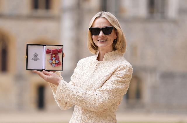 British Actress Carey Mulligan poses with their medal after being appointed a Commander of the Order of the British Empire (CBE) at an investiture ceremony at Windsor Castle, west of London on March 31, 2026. (Photo by Andrew Matthews / POOL / AFP)