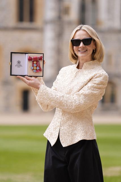 British Actress Carey Mulligan poses with their medal after being appointed a Commander of the Order of the British Empire (CBE) at an investiture ceremony at Windsor Castle, west of London on March 31, 2026. (Photo by Andrew Matthews / POOL / AFP)