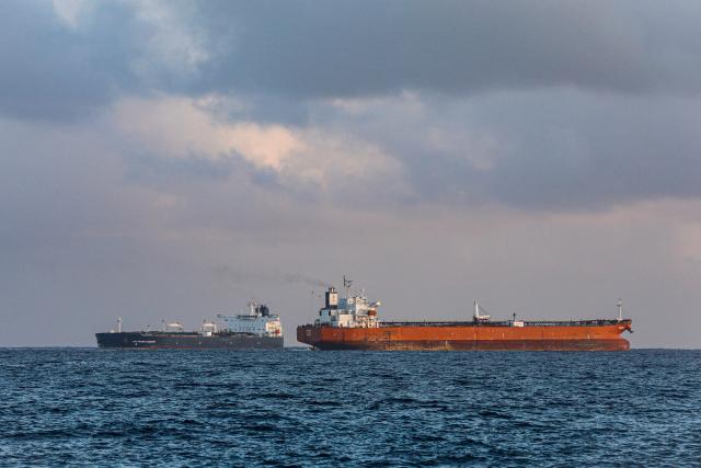 The Russian oil tanker Anatoly Kolodkin (L) sails near the Cuban oil tanker Vilma as is stands in for the port of Matanzas, northwestern Cuba, on March 31, 2026. The Anatoly Kolodkin, a tanker under US sanctions carrying 730,000 barrels of crude, is set to deliver the first crude shipment to Cuba since January after Washington gave the crisis-hit island a reprieve from an effective fuel blockade. (Photo by AFP)