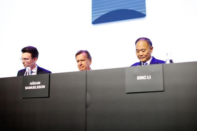 (L to R) Attourney Andreas Steen, Volvo Cars CEO Hakan Samuelsson and Chairman and Board Member of Volvo Cars Eric Li attend Volvo Cars' Annual General Meeting at World of Volvo in Gothenburg, on March 31, 2026. (Photo by Adam Ihse/TT / various sources / AFP) / Sweden OUT