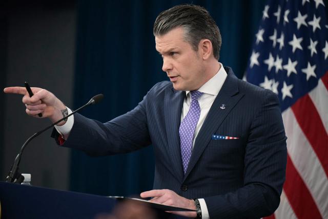 TOPSHOT - US Secretary of Defense Pete Hegseth speaks during a press briefing at the Pentagon in Washington, DC, on March 31, 2026. Hegseth said Tuesday that talks on ending the Iran war are making progress even as the more than month-long US-Israeli military campaign against the Islamic republic continued. "They are very real. They are ongoing, they are active, and I think, gaining strength," Hegseth told reporters of the negotiations. (Photo by Oliver Contreras / AFP)