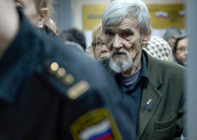 (FILES) Russian historian Yury Dmitriyev, who heads rights group Memorial's branch in Karelia, arrives for the verdict in his child pornography trial at a court in the city of Petrozavodsk in northwestern Russia on April 5, 2018. Europe's top rights court condemned on March 31, 2026 Russia for violating jailed Gulag historian Yury Dmitriyev's rights to short pre-trial detention and a fair hearing, but did not rule his jailing was politically motivated. (Photo by Olga MALTSEVA / AFP)