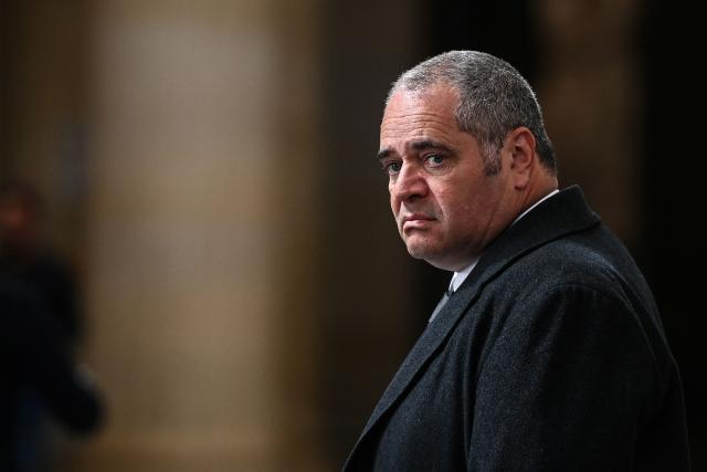 François Thierry, former chief of the French anti-narcotics office (Ocrtis), leaves the courtroom on the last day of his trial on charges of complicity in drug trafficking alongside 17 co-defendants, at the courthouse in Bordeaux, south-western France, on March 31, 2026. (Photo by Christophe ARCHAMBAULT / AFP)