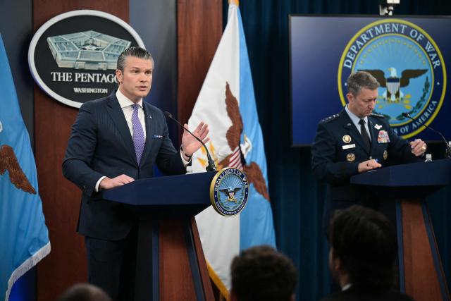 (L/R) US Secretary of Defense Pete Hegseth speaks alongside Chairman of the Joint Chiefs of Staff General Dan Caine during a press briefing at the Pentagon in Washington, DC, on March 31, 2026. Hegseth said Tuesday that talks on ending the Iran war are making progress even as the more than month-long US-Israeli military campaign against the Islamic republic continued. "They are very real. They are ongoing, they are active, and I think, gaining strength," Hegseth told reporters of the negotiations. (Photo by Oliver Contreras / AFP)