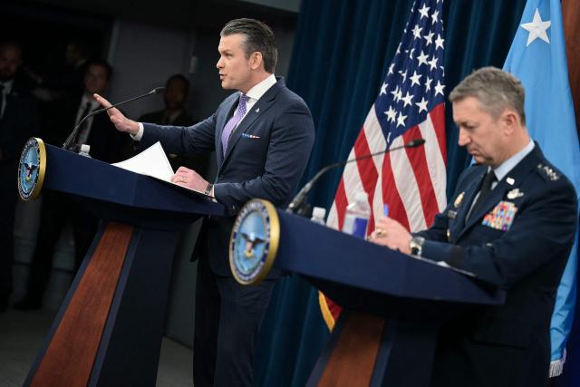 (L/R) US Secretary of Defense Pete Hegseth speaks alongside Chairman of the Joint Chiefs of Staff General Dan Caine during a press briefing at the Pentagon in Washington, DC, on March 31, 2026. Hegseth said Tuesday that talks on ending the Iran war are making progress even as the more than month-long US-Israeli military campaign against the Islamic republic continued. "They are very real. They are ongoing, they are active, and I think, gaining strength," Hegseth told reporters of the negotiations. (Photo by Oliver Contreras / AFP)