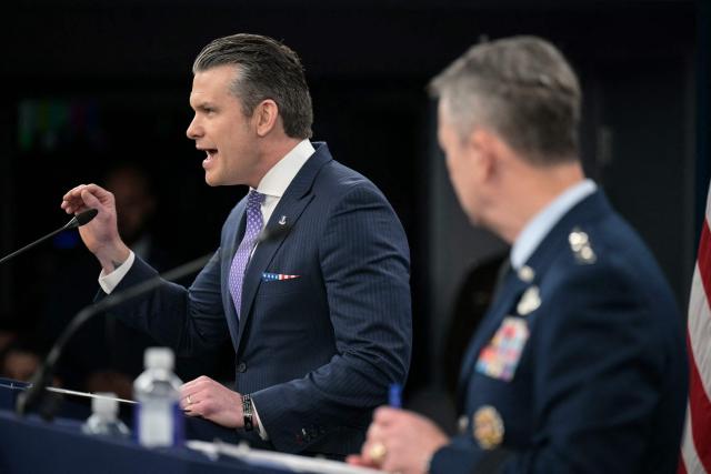 (L/R) US Secretary of Defense Pete Hegseth speaks alongside Chairman of the Joint Chiefs of Staff General Dan Caine during a press briefing at the Pentagon in Washington, DC, on March 31, 2026. Hegseth said Tuesday that talks on ending the Iran war are making progress even as the more than month-long US-Israeli military campaign against the Islamic republic continued. "They are very real. They are ongoing, they are active, and I think, gaining strength," Hegseth told reporters of the negotiations. (Photo by Oliver Contreras / AFP)