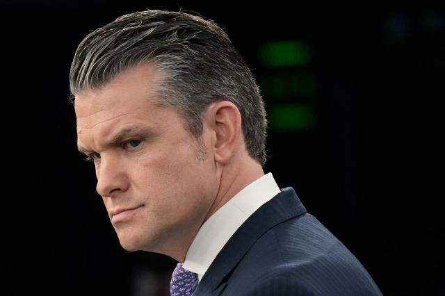 US Secretary of Defense Pete Hegseth looks on during a press briefing at the Pentagon in Washington, DC, on March 31, 2026. Hegseth said Tuesday that talks on ending the Iran war are making progress even as the more than month-long US-Israeli military campaign against the Islamic republic continued. "They are very real. They are ongoing, they are active, and I think, gaining strength," Hegseth told reporters of the negotiations. (Photo by Oliver Contreras / AFP)