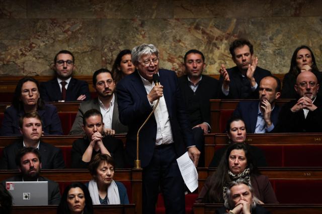 La France Insoumise - Nouveau Front Populaire's MP Eric Coquerel (C) speaks during a session of questions to the government at The National Assembly, France's lower house of parliament in Paris on March 31, 2026. (Photo by Anne-Christine POUJOULAT / AFP)