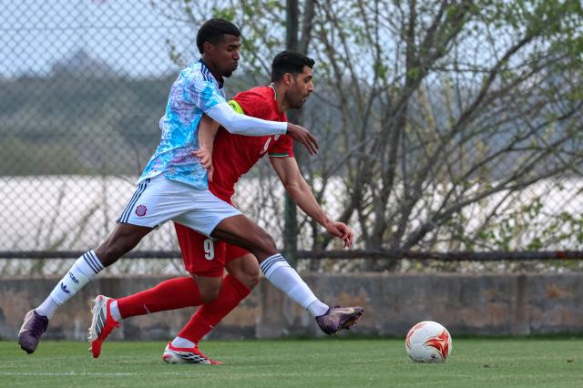 Costa Rica's defender #8 Gerald Taylor fauls Iran's forward #9 Mehdi Taremi in the penalty areaduring a friendly football match between Iran and Costa Rica, in Antalya, southern Turkey, on March 31, 2026. FIFA's president told AFP that Iran "will be at the World Cup" despite the Middle East war. (Photo by Adem ALTAN / AFP)