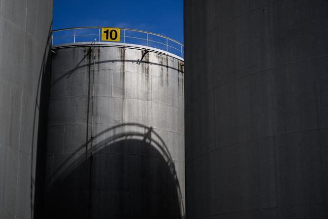 This photograph shows gasoline and fuel tanks in Vernier near Geneva on March 31, 2026. The US-Israeli war on Iran has expanded across the Gulf and beyond, upending global energy markets and trade, and virtually halting traffic in the Strait of Hormuz, through which a fifth of the world's crude oil travels. (Photo by Fabrice COFFRINI / AFP)