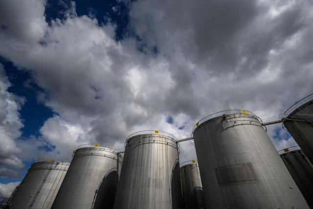 This photograph shows gasoline and fuel tanks in Vernier near Geneva on March 31, 2026. The US-Israeli war on Iran has expanded across the Gulf and beyond, upending global energy markets and trade, and virtually halting traffic in the Strait of Hormuz, through which a fifth of the world's crude oil travels. (Photo by Fabrice COFFRINI / AFP)