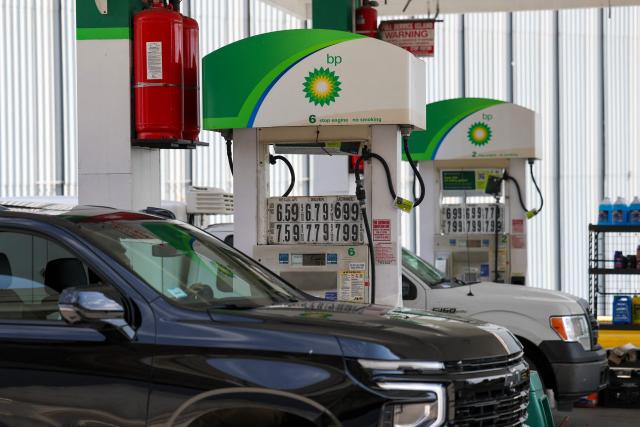Gas prices are displayed at the pumps at a gas station in the Manhattan borough of New York on March 31, 2026. Inflation expectations among US consumers surged in March to levels last seen around seven months ago, following rocketing energy prices due to war in the Middle East, survey data showed Tuesday. The report is being monitored for how American households respond to price pressures as gasoline costs jump after US-Israeli strikes on Iran plunged the region into war. (Photo by ANGELA WEISS / AFP)