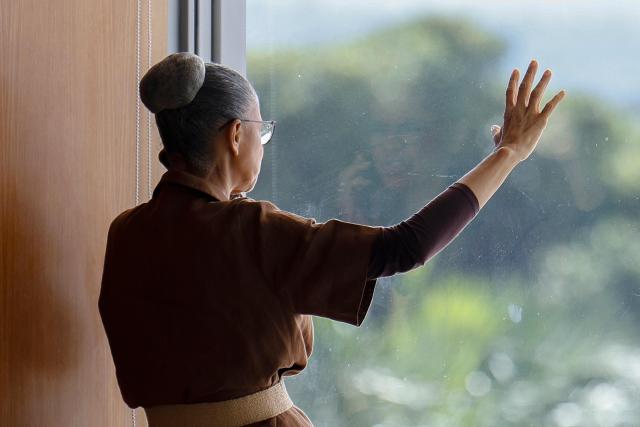 Brazil’s Environment Minister Marina Silva uses her cellphone before President Lula’s speech during a ministerial meeting at the Palacio do Planalto in Brasilia, Brazil, on March 31, 2026. (Photo by Sergio Lima / AFP)