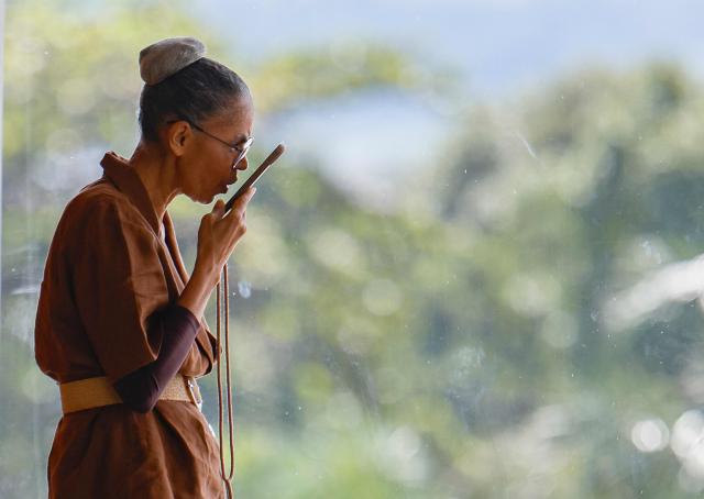 Brazil’s Environment Minister Marina Silva uses her cellphone before President Lula’s speech during a ministerial meeting at the Palacio do Planalto in Brasilia, Brazil, on March 31, 2026. (Photo by Sergio Lima / AFP)