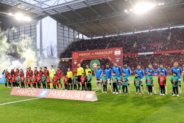 Marocco's and Uruguay's team players pose ahead of the friendly football match between Marocco and Uruguay at the Stade Bollaert-Delelis in Lens, northern France on March 31, 2026. (Photo by Francois LO PRESTI / AFP)