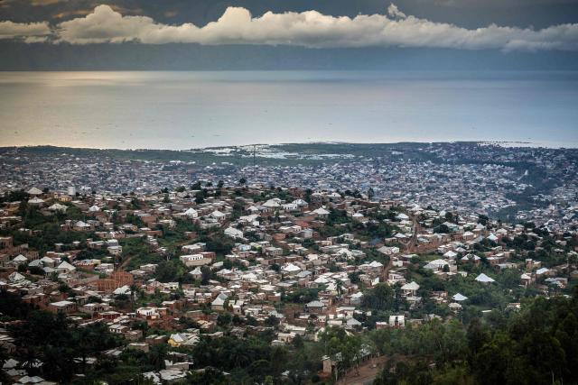 (FILES) A general view of a densely populated residential area along the shores of Lake Tanganyika in Bujumbura, on May 7, 2025. Multiple explosions ripped through the city of Bujumbura after a fire broke out late on March 31, 2026 at a military arsenal in Burundi's economic capital, an army spokesman said. (Photo by Luis TATO / AFP)