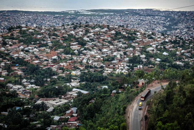 (FILES) A general view of a densely populated residential area along the shores of Lake Tanganyika in Bujumbura, on May 7, 2025. Multiple explosions ripped through the city of Bujumbura after a fire broke out late on March 31, 2026 at a military arsenal in Burundi's economic capital, an army spokesman said. (Photo by Luis TATO / AFP)