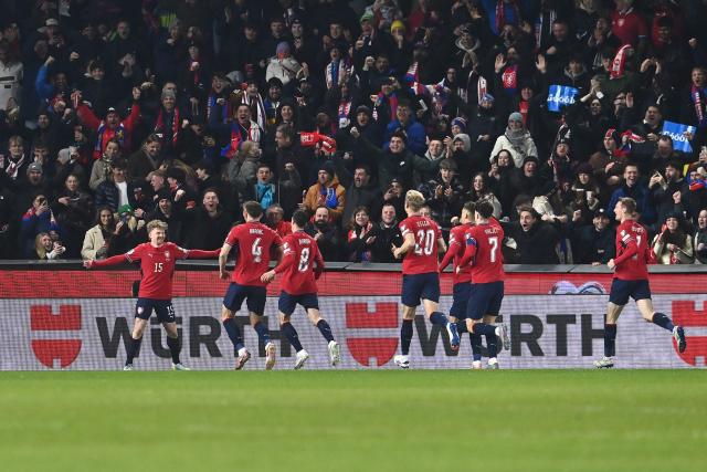 Czech Republic's midfielder #15 Pavel Sulc (L) celebrates scoring the opening goal 1-0 during the FIFA World Cup 2026 European qualification final football match Czech Republic vs Denmark on March 31, 2026 in Prague, Czech Republic. (Photo by Michal Cizek / AFP)