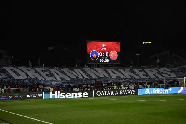 A banner reading "dreammakers" is seen in the stand during the FIFA World Cup 2026 European qualification final football match between Kosovo and Turkey at the Fadil Vokrri stadium in Pristina on March 31, 2026. (Photo by Armend NIMANI / AFP)