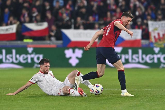 Czech Republic's midfielder #14 Lukas Provod (R) and Denmark's midfielder #23 Pierre-Emile Hojbjerg (L) vie for the ball during the FIFA World Cup 2026 European qualification final football match Czech Republic vs Denmark on March 31, 2026 in Prague, Czech Republic. (Photo by Michal Cizek / AFP)