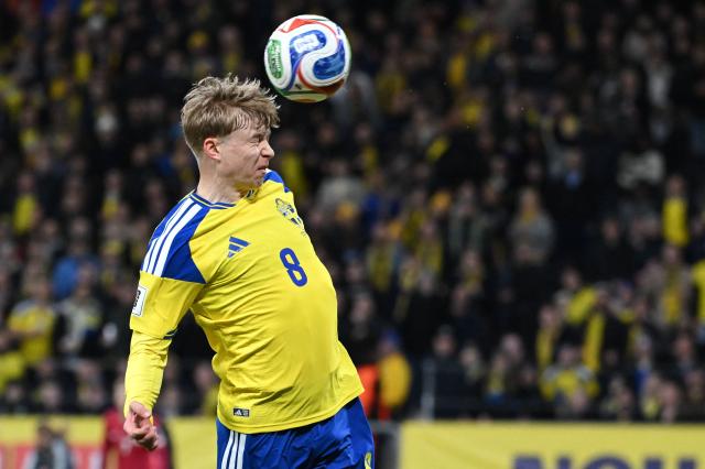 Sweden's defender #08 Daniel Svensson heads the ball during the FIFA World Cup 2026 European qualification final football match between Sweden and Poland in Solna, Sweden, on March 31, 2026. (Photo by Jonathan Nackstrand / AFP)