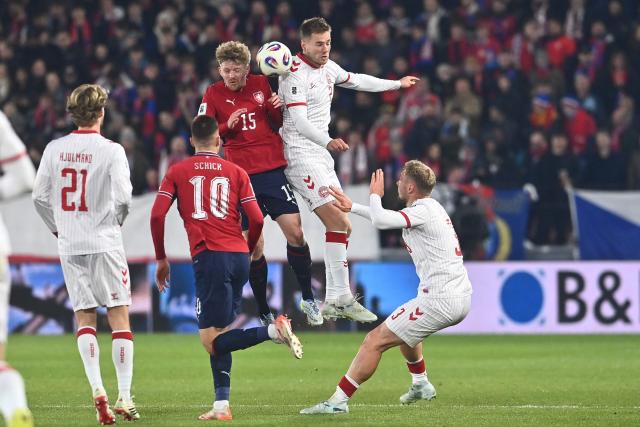 Czech Republic's midfielder #15 Pavel Sulc (3rd L) and Denmark's defender #02 Joachim Andersen (2nd R) vie for a header during the FIFA World Cup 2026 European qualification final football match Czech Republic vs Denmark on March 31, 2026 in Prague, Czech Republic. (Photo by Michal Cizek / AFP)