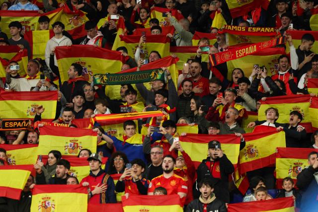 Spain supporters hold up flags during the international friendly football match between Spain and Egypt at RCDE Stadium in Cornella de Llobregat, near Barcelona, on March 31, 2026. (Photo by Lluis GENE / AFP)