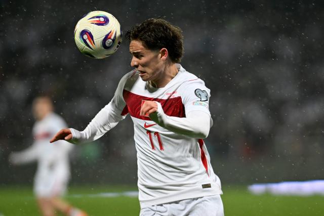 Turkey's forward #11 Kenan Yildiz heads the ball during the FIFA World Cup 2026 European qualification final football match between Kosovo and Turkey at the Fadil Vokrri stadium in Pristina on March 31, 2026. (Photo by Armend NIMANI / AFP)