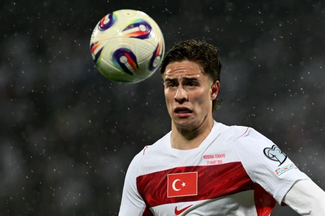 Turkey's forward #11 Kenan Yildiz eyes the ball during the FIFA World Cup 2026 European qualification final football match between Kosovo and Turkey at the Fadil Vokrri stadium in Pristina on March 31, 2026. (Photo by Armend NIMANI / AFP)