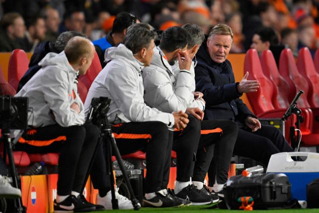 Netherlands' coach Ronald Koeman (R) gestures from the techincal area during the friendly international football match between the Netherlands and Ecuador at the PSV Stadium in Eindhoven on March 31, 2026. (Photo by JOHN THYS / AFP)