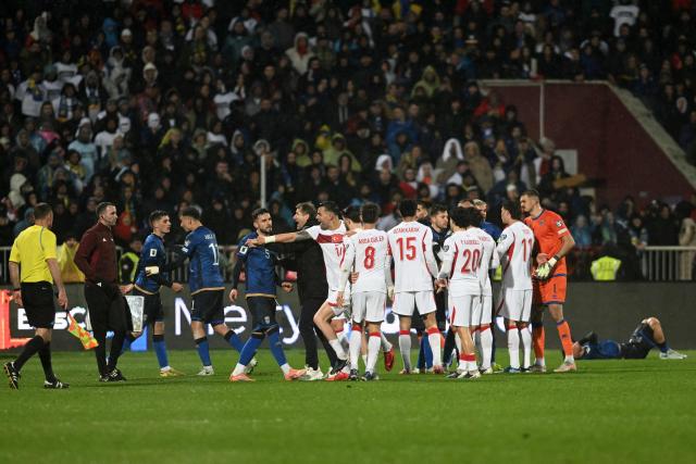 Kosovo's players and Turkey's players clash with each other during the FIFA World Cup 2026 European qualification final football match between Kosovo and Turkey at the Fadil Vokrri stadium in Pristina on March 31, 2026. (Photo by Armend NIMANI / AFP)