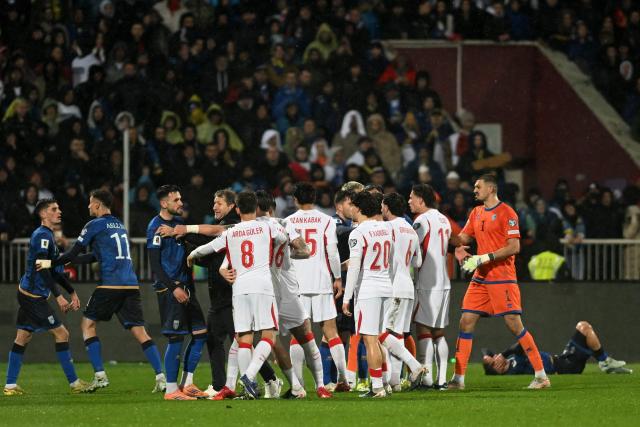 Kosovo's players and Turkey's players clash with each other during the FIFA World Cup 2026 European qualification final football match between Kosovo and Turkey at the Fadil Vokrri stadium in Pristina on March 31, 2026. (Photo by Armend NIMANI / AFP)