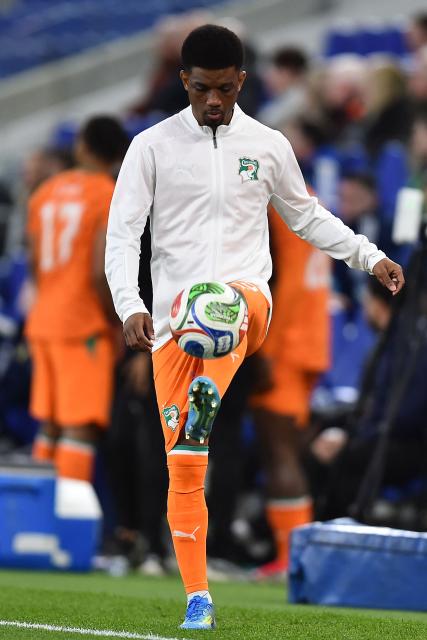Ivory Coast's forward #15 Amad Diallo warms up during the friendly international football match between Scotland and Ivory Coast at the Hill Dickinson Stadium in Liverpool, north west England on March 31, 2026.  (Photo by PETER POWELL / AFP)