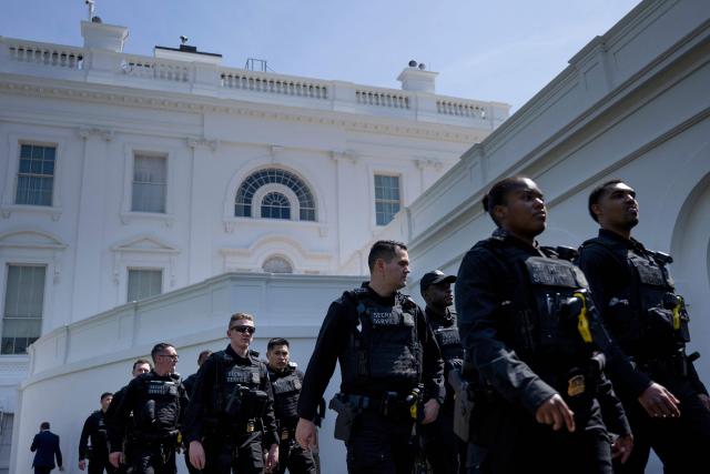 Members of the US Secret Service uniformed division walk toward the West Wing of the White House on March 31, 2026, in Washington, DC. (Photo by Brendan Smialowski / AFP)