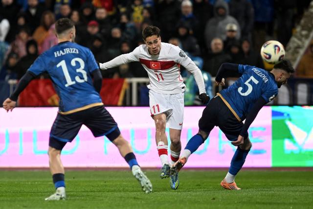 Turkey's forward #11 Kenan Yildiz (C) shoots the ball during the FIFA World Cup 2026 European qualification final football match between Kosovo and Turkey at the Fadil Vokrri stadium in Pristina on March 31, 2026. (Photo by Armend NIMANI / AFP)