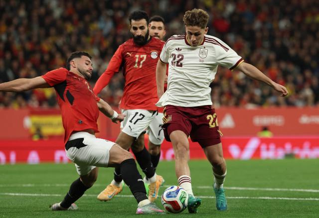 Spain's forward #22 Fermin Lopez (R) vies for the ball with Egypt's defender #2 Yasser Ibrahim during the international friendly football match between Spain and Egypt at RCDE Stadium in Cornella de Llobregat, near Barcelona, on March 31, 2026. (Photo by Lluis GENE / AFP)