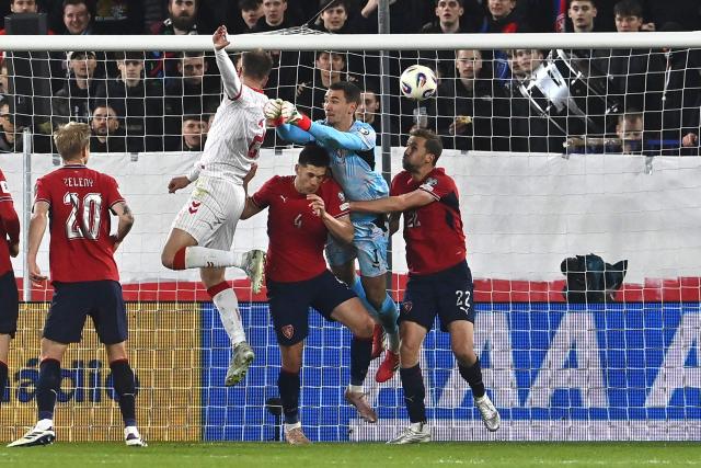 Denmark's defender #02 Joachim Andersen (4th R) jumps to score the equalizing goal 1-1 during the FIFA World Cup 2026 European qualification final football match Czech Republic vs Denmark on March 31, 2026 in Prague, Czech Republic. (Photo by Michal Cizek / AFP)