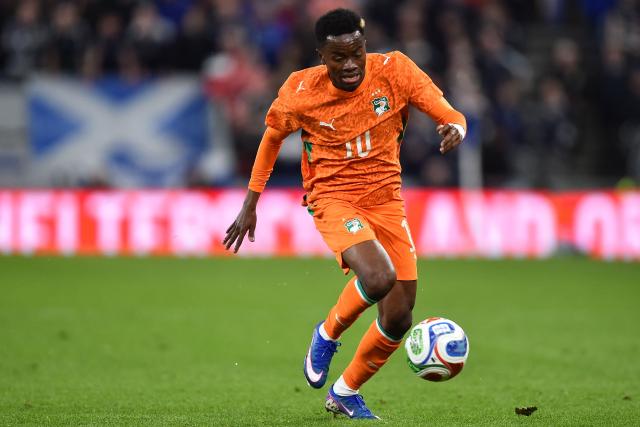 Ivory Coast's forward #10 Simon Adingra runs with the ball during the friendly international football match between Scotland and Ivory Coast at the Hill Dickinson Stadium in Liverpool, north west England on March 31, 2026.  (Photo by PETER POWELL / AFP)