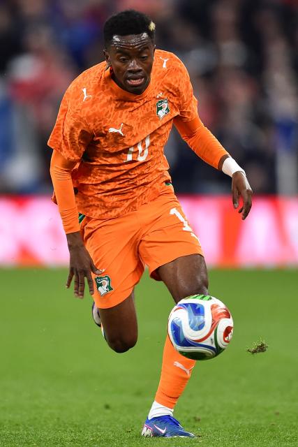 Ivory Coast's forward #10 Simon Adingra runs with the ball during the friendly international football match between Scotland and Ivory Coast at the Hill Dickinson Stadium in Liverpool, north west England on March 31, 2026.  (Photo by PETER POWELL / AFP)