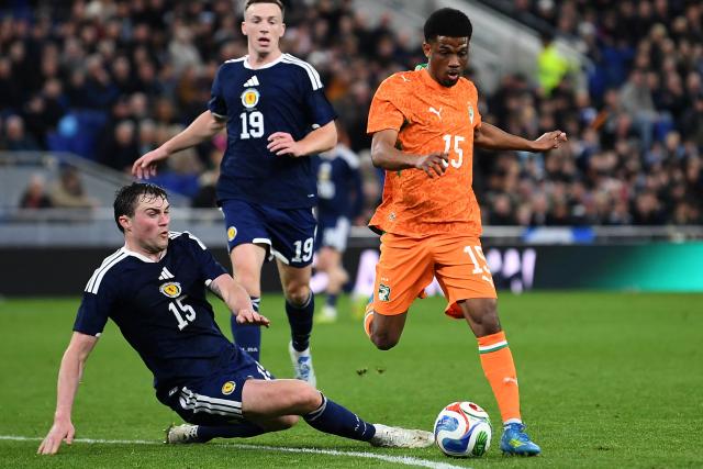 Ivory Coast's forward #15 Amad Diallo (R) vies with Scotland's defender #15 John Souttar (L) during the friendly international football match between Scotland and Ivory Coast at the Hill Dickinson Stadium in Liverpool, north west England on March 31, 2026.  (Photo by PETER POWELL / AFP)